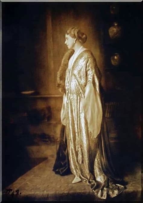 An Old Fashion Photo Of A Woman In Gold