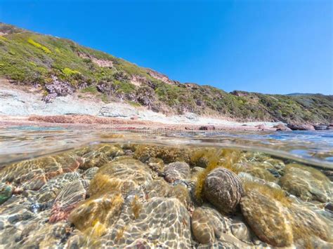 Split Underwater View Of La Speranza Beach On A Sunny Day Stock Image