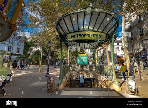 People Entering And Leaving Abbesses Metro Station In Montmartre Paris