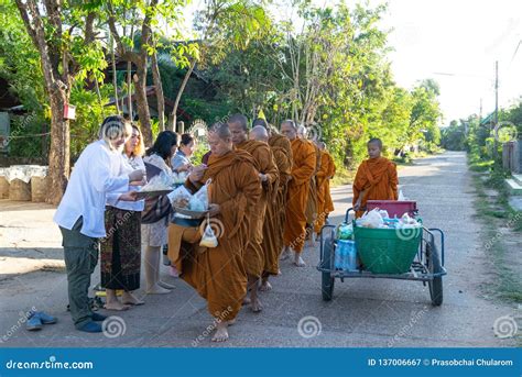 People Give Alms To A Buddhist Monk Beliefs And Religious Culture