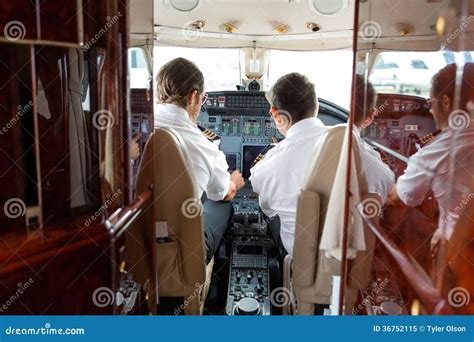 Pilots Operating Controls of Private Jet Stock Image - Image of caucasian, operate: 36752115