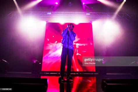 Canadian Singer Daniel Caesar Performs Live On Stage During A Concert