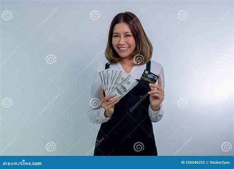 Asian Woman In Apron Posing Holding Cash Money In Dollar And Credit