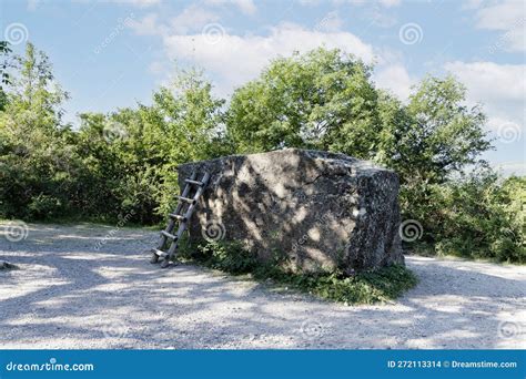 A Large Huge Stone Megalith With A Staircase Against The Background Of