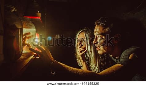 Frightened Couple Looking Canned Limbs Maniacs Stock Photo 649155325