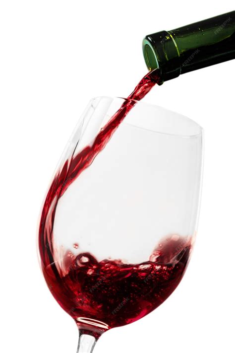 Premium Photo Pouring Red Wine Into A Glass Isolated