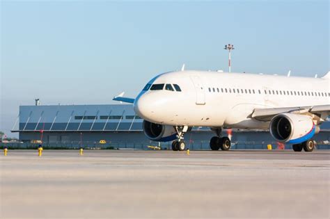 Premium Photo | Taxiing passenger aircraft on the airport apron