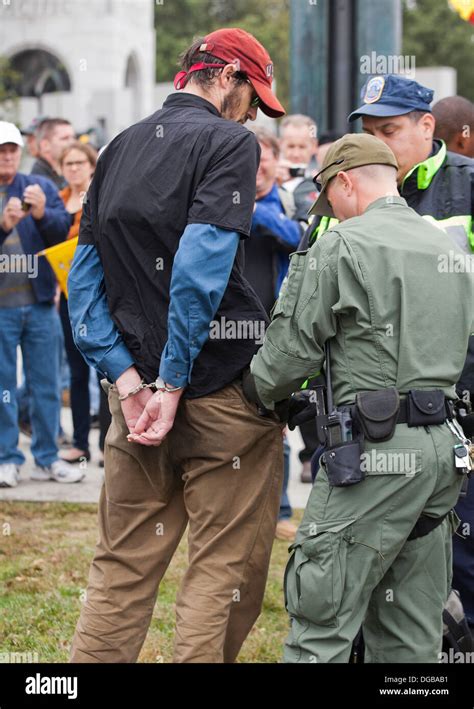 Man detained, placed under arrest and in handcuffs by police Stock ...