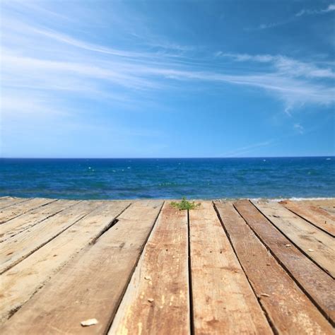 Premium Photo Wooden Deck With Sea And Blue Sky