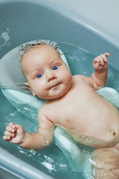 Premium Photo Bathing A Baby In A Bathtub On A Stand Babys First Bath