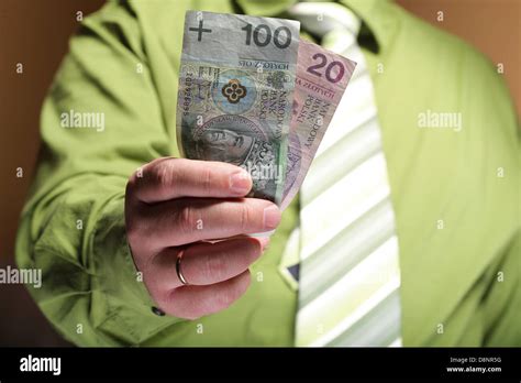 Businessman Holding Polish Money Hundred Zloty Banknote Stock Photo Alamy