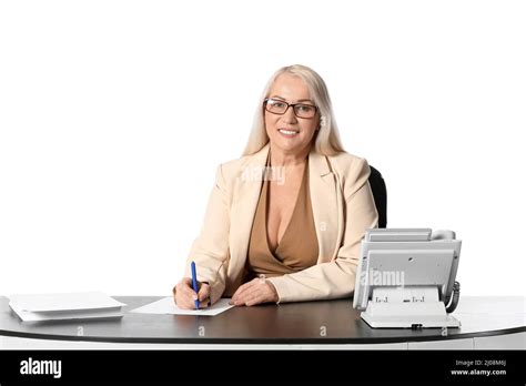 Mature Secretary At Table On White Background Stock Photo Alamy