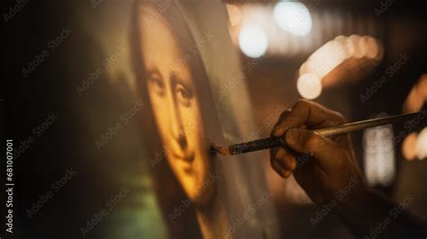 Close Up on Male Painter Hand Painting the Mona Lisa with Gentle Brush ...