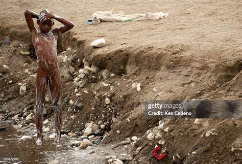 A Young Boy Bathes In Jacmel River Outside The Port City Of The Same