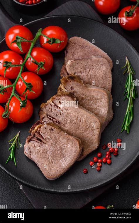 Delicious Boiled Beef Tongue Sliced With Vegetables And Spices On A