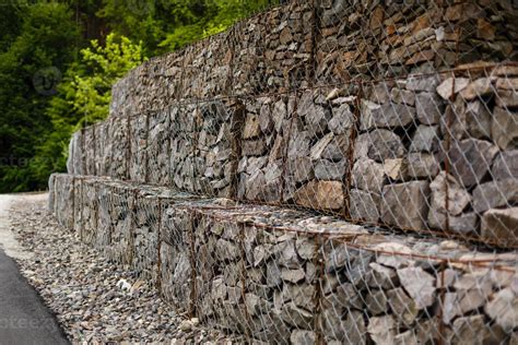 Slope And Earth Retention Wall Management With Rocks And Wire Mesh Cage