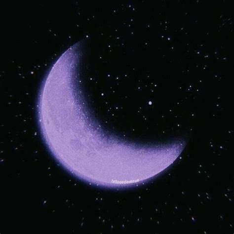 A Purple Crescent Moon In The Night Sky