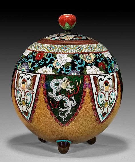 An Ornately Decorated Vase With A Red Apple On Top