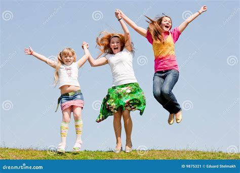 Happy Mother And Two Daughter Jumping Stock Image Image Of Happy