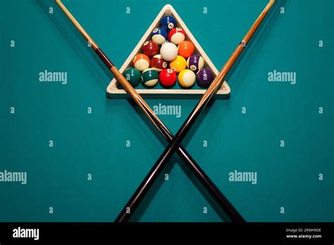 Billiard Accessories Balls And Crossed Cues On A Billiard Table Stock