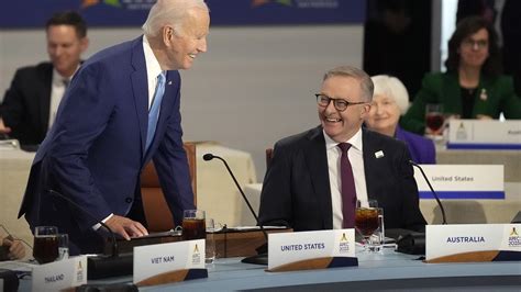 Anthony Albanese Grins As He Sits Next To Joe Biden And Poses With