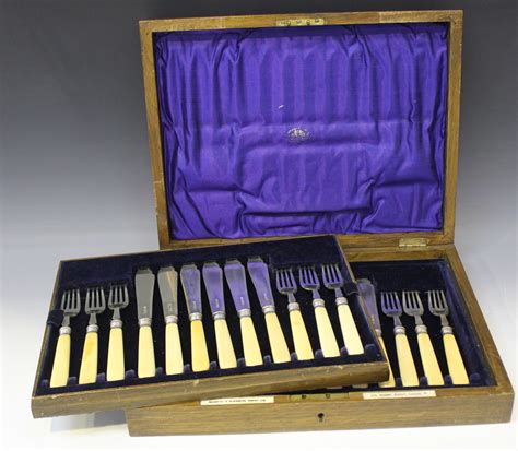 A Set Of Twelve Silver Fish Knives And Forks With Bone Handles