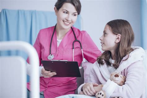 Smiling Pediatrician with Stethoscope and Healthy Girl in the Pr Stock ...