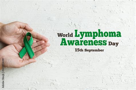 World Lymphoma Awareness Day Woman Hands Holds Green Ribbon On White