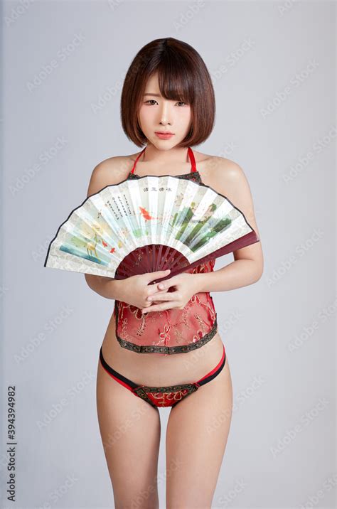 Sexy Chinese Girl In Bikini Dressed Carry A Pair Of Chinese Fans Dancing Sexy Acting In