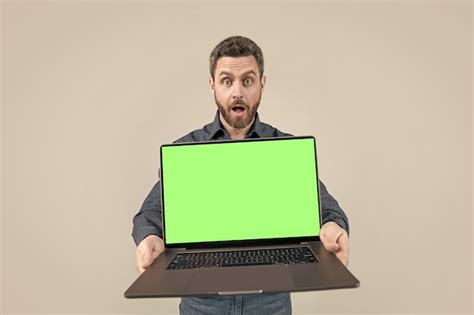 Premium Photo Shocked Mature Man Businessman Presenting Computer