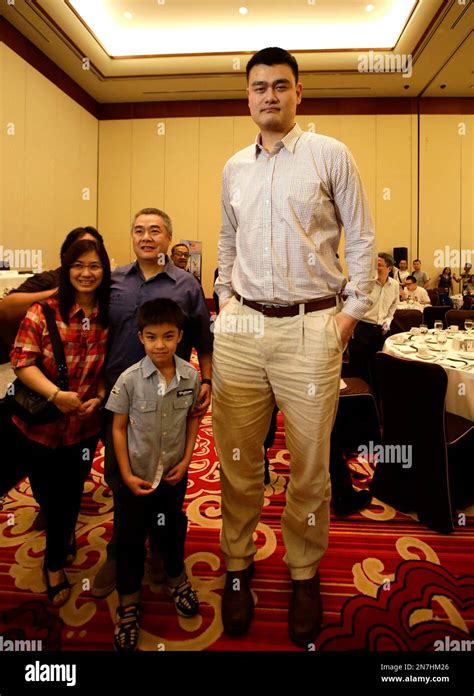 Former Nba Houston Rockets Basketball Player Yao Ming Poses With