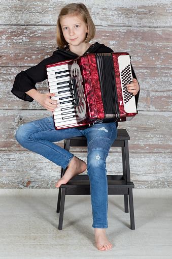 Young Accordionist Playing An Accordion Stock Photo Download Image