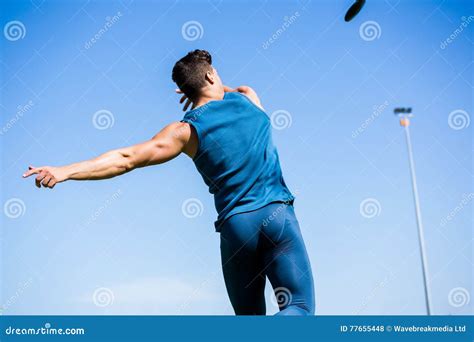 Athlete Throwing Discus In Stadium Stock Photo Image Of Athletic