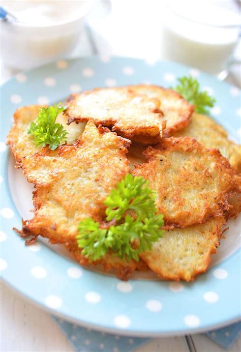 Some Fried Food On A Blue Plate With White Polka Dot Tablecloth And