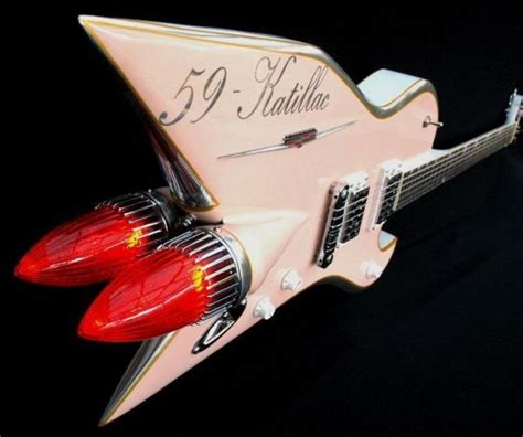 A Pink Electric Guitar With The Number 59 Atlanta On Its Taillight And