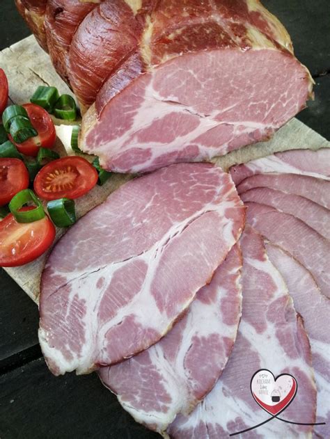 Ham Slices Tomatoes And Peppers On A Cutting Board