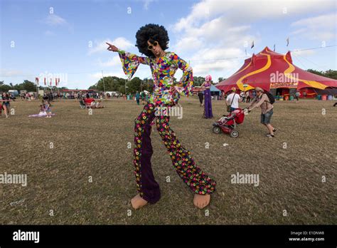 Man With A 70s Psychedelic Dress In Glastonbury Festival 2013 Stock