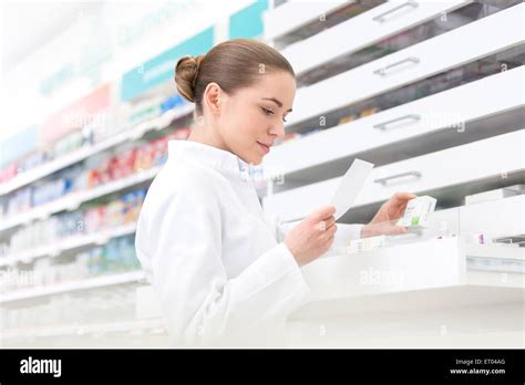 Pharmacist Filling Prescription In Pharmacy Stock Photo Alamy