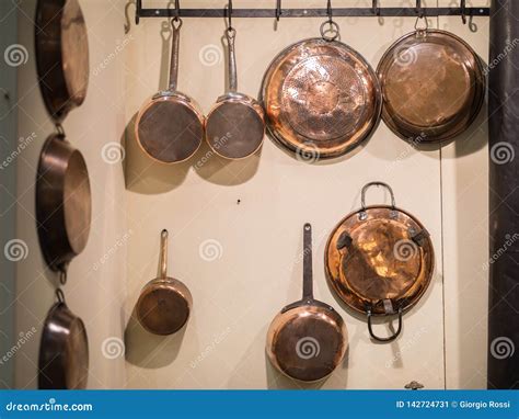 Copper Pots and Pans Hanging on the Wall Stock Image - Image of food ...