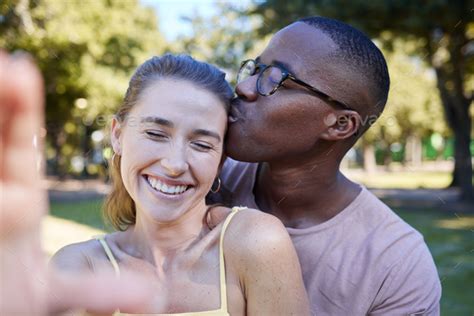 Love Kiss And Selfie With Interracial Couple At Park For Relax Social