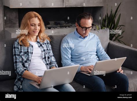 Addicted Mature Woman And Aged Father Using Laptops Indoors Stock Photo Alamy