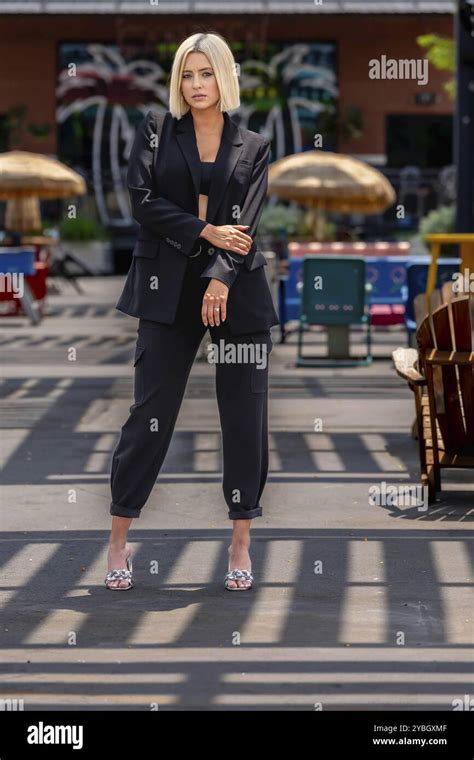 A Gorgeous Blonde Model Poses Outdoors While Enjoying The Summer Weather Stock Photo Alamy