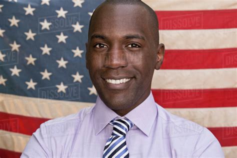 Smiling Man In Front Of American Flag Stock Photo Dissolve