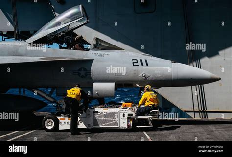 Sailors Assigned To Air Departments V Division Prepare To Move An F