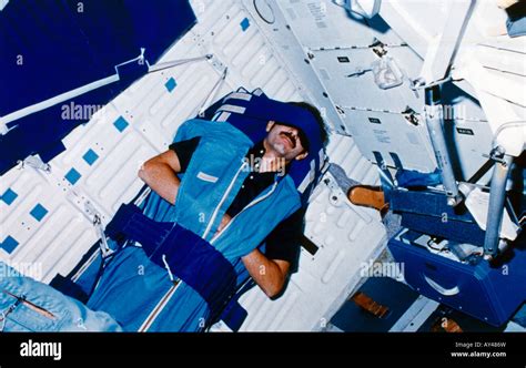 Astronaut Sleeping In Space Stock Photo - Alamy