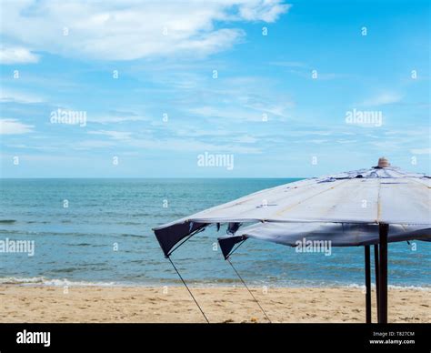 Large umbrella at the beach Stock Photo - Alamy