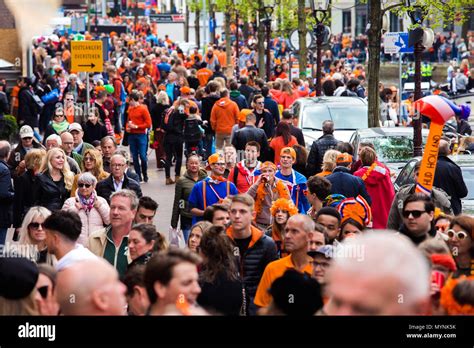 Crowd Of People On The Street Celebrate King S Day In Amsterdam City