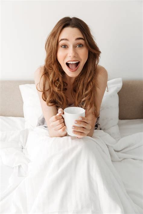 Portrait Of Happy Excited Woman Resting After Sleep In Bed With Stock