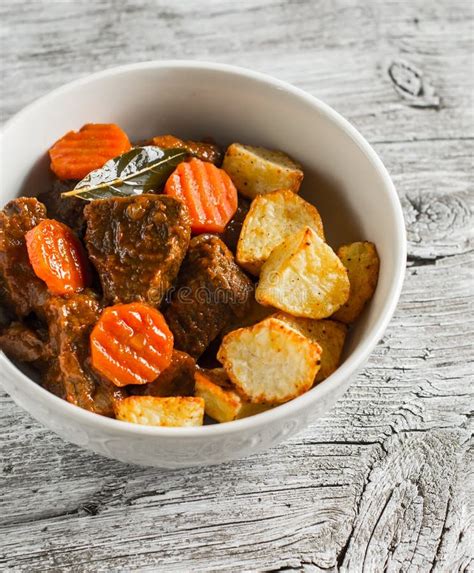 Beef Stew With Roasted Potatoes In A White Bowl Stock Photo Image Of