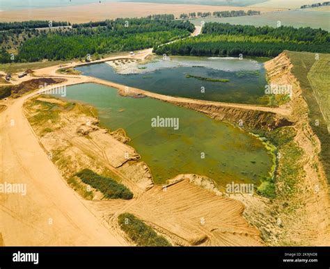 Process Of Construction Sand Mining From Open Huge Quarry Stock Photo